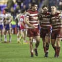 Brad O'Neill, Joe Shorrocks and Liam Byrne celebrate the Round 9 win over Warrington at the Halliwell Jones Stadium