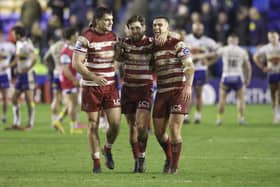 Brad O'Neill, Joe Shorrocks and Liam Byrne celebrate the Round 9 win over Warrington at the Halliwell Jones Stadium