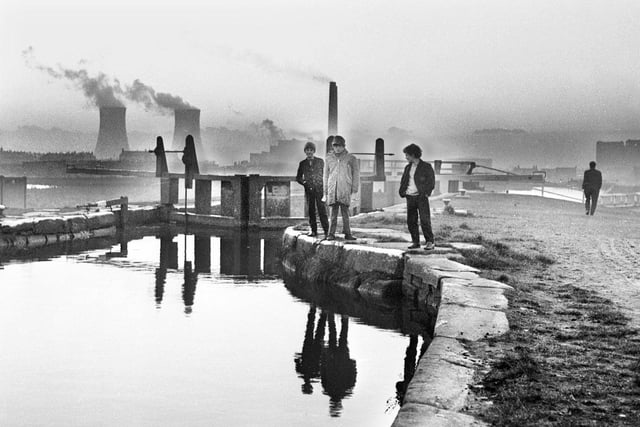 A moody view on the canal locks in Ince with Westwood power station in full flow in 1971.