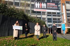 Representatives from DIAS and Wigan Council gather to mark the beginning of 16 days of action