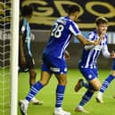 Callum Lang celebrates his goal - his first in over a year - as Latics hit a magnificent seven