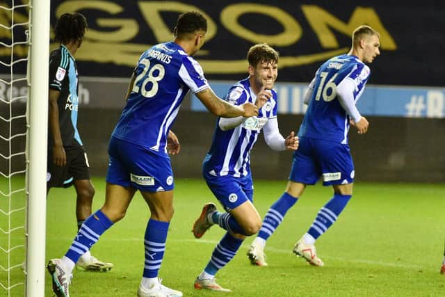 Callum Lang celebrates his goal - his first in over a year - as Latics hit a magnificent seven