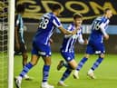 Callum Lang celebrates his goal - his first in over a year - as Latics hit a magnificent seven