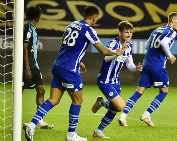Callum Lang celebrates his goal - his first in over a year - as Latics hit a magnificent seven