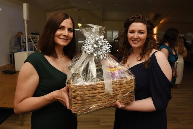 Some of the organisers, Sally Owen-Gahan and Helen Doward, with one of the many raffle prizes at The Midsummer Ball, organised by The Shoebox Fairies.