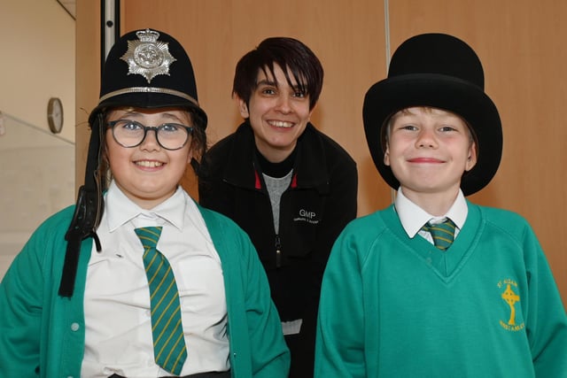Pupils try on items from the Manchester Police Museum.