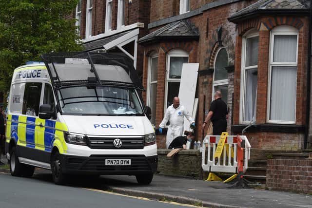 Police officers at the house on Upper Dicconson Street