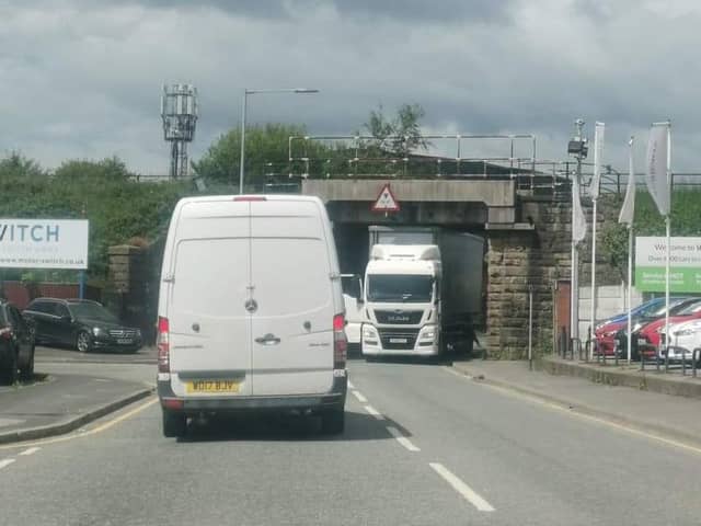 The lorry got stuck under a low railway bridge in Miry Lane, Wigan