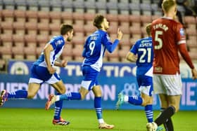Joe Hugill celebrates opening his goalscoring account for Latics against Morecambe