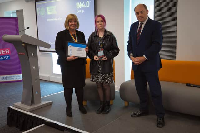 Louise Tipping and Charlotte Speed receiving a Silver Award certificate from Defence Secretary Ben Wallace