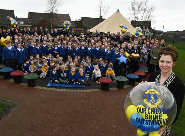 Headteacher Mel Smith, right, celebrates with staff and pupils at St Marie's Catholic Primary School, Standish