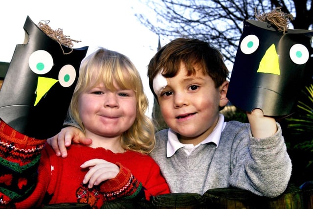 What a hoot.....St. Marie's pre-school children, Natalie Bishop and Jonathan Siney, with owl masks they made with a group in Standish Library as part of the Lancashire Day celebrations in Standish on Monday 27th of November 2000.