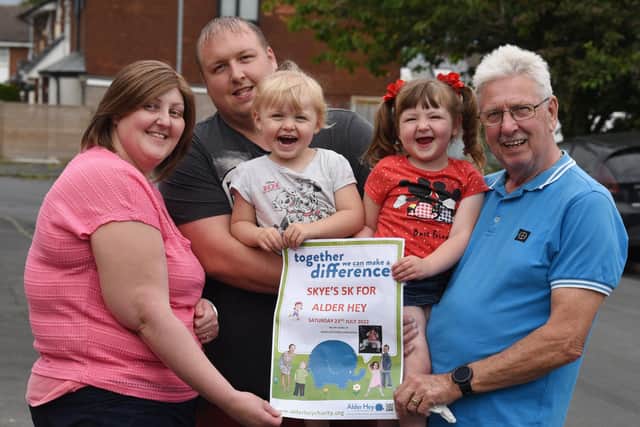 Three-year-old Skye McSorley, from Orrell. is walking 5K for Alder Hey children's hospital, with her grandad Cliff - Skye was treated at Alder Hey for developmental hip dysplasia when she was 15-months-old. 
from left, Mum Emma Walsh, dad Mike McSorely, sister Daisy, two, Skye McSorley, three, and grandad Cliff McSorley.