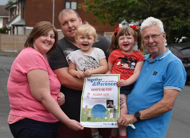 Three-year-old Skye McSorley, from Orrell. is walking 5K for Alder Hey children's hospital, with her grandad Cliff - Skye was treated at Alder Hey for developmental hip dysplasia when she was 15-months-old. 
from left, Mum Emma Walsh, dad Mike McSorely, sister Daisy, two, Skye McSorley, three, and grandad Cliff McSorley.