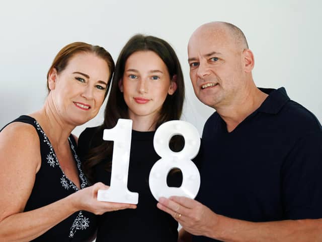 Emma Hoolin with proud parents Jill and Mark as she celebrates her 18th birthday