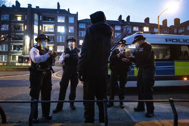 Police officers and special constables talking to a suspect following a stop and search (file picture)