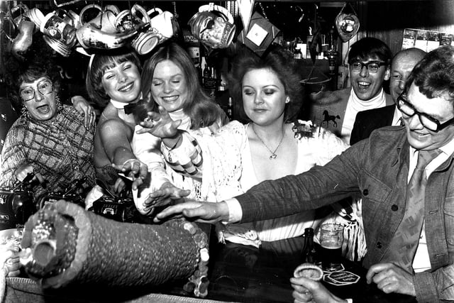 Retro 1978 - It was a familiar event during the 1970s, with pub regulars donating their loose change to charity in the form of a tower of pennies.  Aptly named the 'Pile of Pennies' it was  pushed over as seen here in The Guardians on Frog Lane in Wigan.