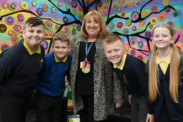 Headteacher Carol Whiting with pupils at Newton Westpark Primary School, Leigh.
