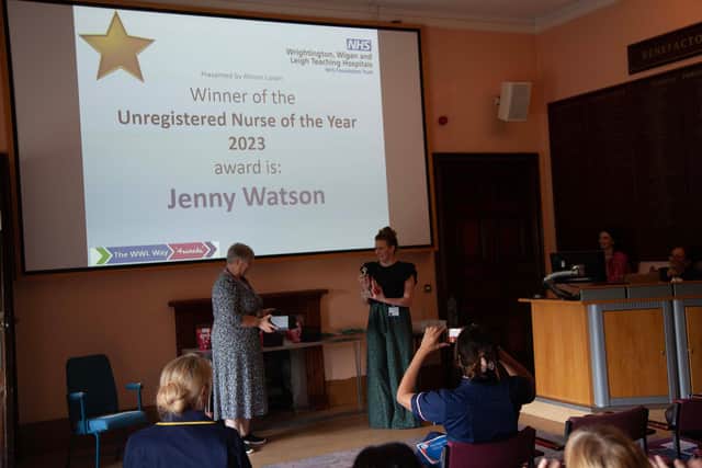Jenny Watson is presented with the unregistered nurse of the year award by Allison Luxon, deputy director of nursing