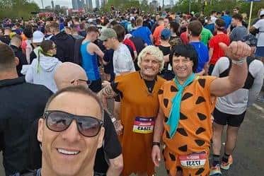 Mike Koch and Ed Edwards completed the Manchester Marathon barefoot dressed as Barney Rubble and Fred Flintstone