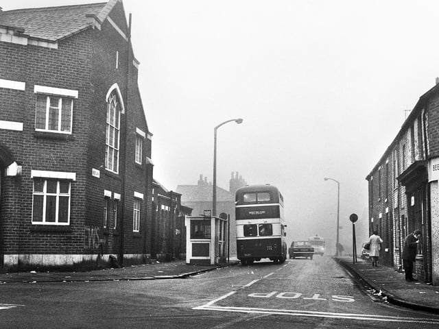 Looking along Scot Lane from the junction with Ormskirk Road, Newtown, in December 1971. On the left is Pemberton Wesleyan Methodist (Brunswick Chapel) and on the right a corner of Brown's Off Licence.