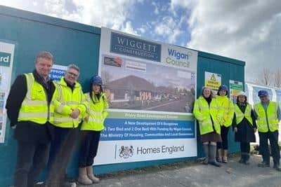 Coun Susan Gambles at the development site on Priory Road, with representatives of Wigan Council and Wiggett Construction