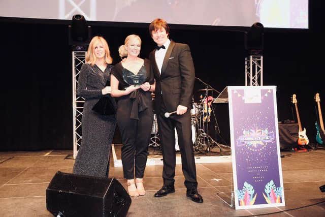 Kate Garraway, left presents Zofia Goddard, centre, with the National Care Home Worker Award