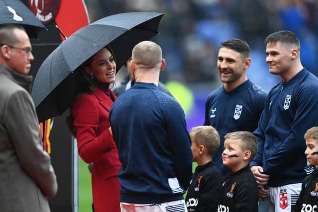 The Princess of Wales interacts with Sam Tomkins ahead of England's quarter-final (Photo by Gareth Copley/Getty Images)
