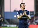 Cade Cust applauds the Wigan fans at full time
