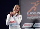 Keely Hodgkinson celebrates with her gold medal