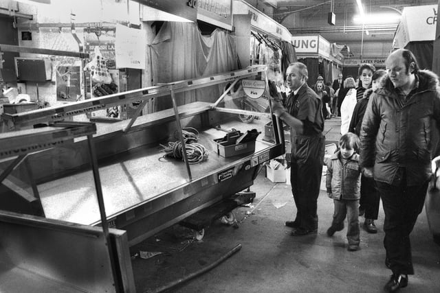 Frank King's butchers stall fittings are removed on the last day of trading in Wigan Market Hall on Saturday 16th of January 1988.