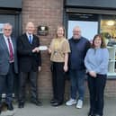 John Mason hands over a cheque for £600 to Maureen Holcroft, founder of Daffodils Dreams