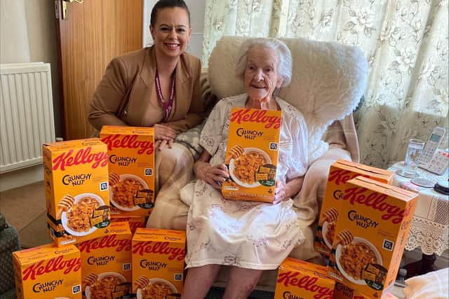 Leanne and Elsie with her gifted boxes of Crunchy Nut cereal.