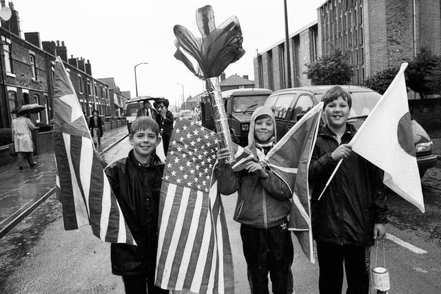 The summer Olympic Games in Spain are commemorated by these lads in the pouring rain at Newtown Gala on Saturday 8th of August 1992.