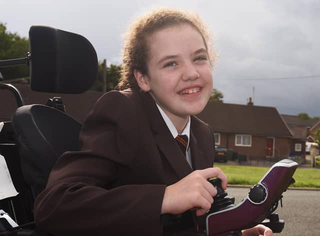 Amy Fairhurst, 12, from Orrell, has cerebral palsy and needs to raise £23,000 for an operation to help stop painful spasms.
