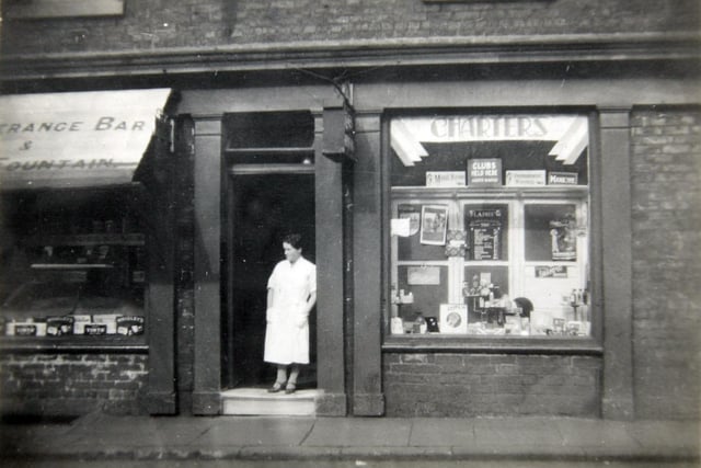 Edith Yates, mother of reader Christine Rigby who sent in this picture, outside her hairdressing shop in Hindley in 1936
