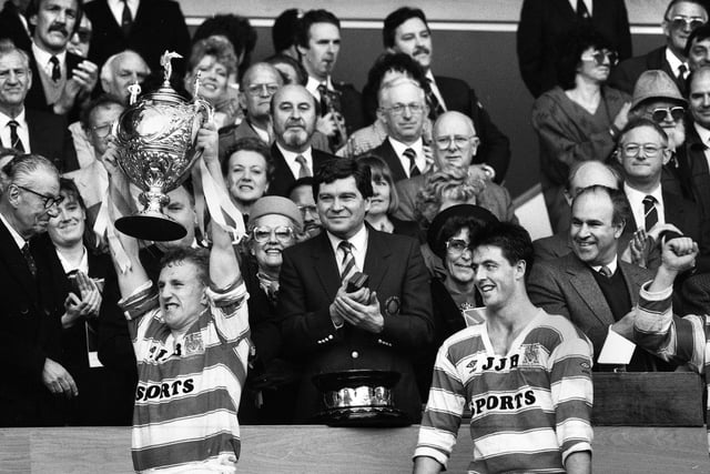 Wigan captain Shaun Edwards lifts the trophy watched by Joe Lydon after beating Halifax in the Challenge Cup Final at Wembley on Saturday 29th of April 1988. Wigan won the match 32-12.