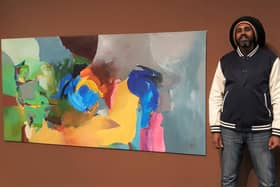 Ahmed with his artwork