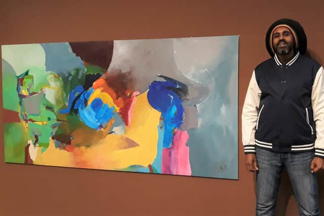Ahmed with his artwork