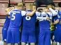 The Latics players celebrate victory over Blackburn