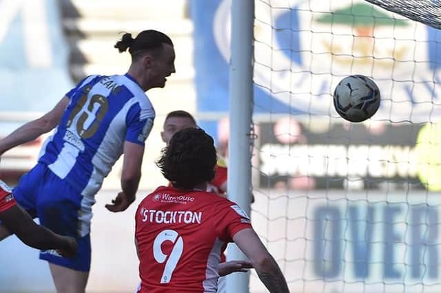 Will Keane forces home Wigan's third goal