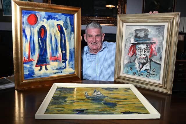 Wigan businessman Tony Callaghan is preparing to sell his collection of Lawrence Isherwood artwork, pictured with some of the Wigan artist's paintings from a collection of over 150