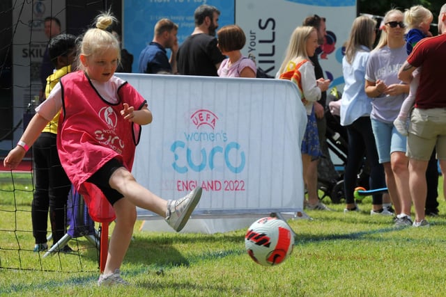 Family fun at children and adults take part in the interactive workshops at the Women's Euro 2022 Roadshow, held at Mesnes Park, Wigan.