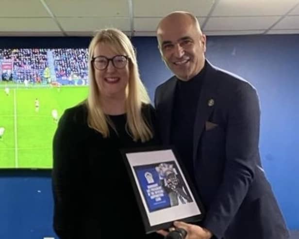 Roberto Martinez becomes the first honourary president of the new Wigan Athletic Supporters Trust, watched by Supporters Club chair Caroline Molyneux