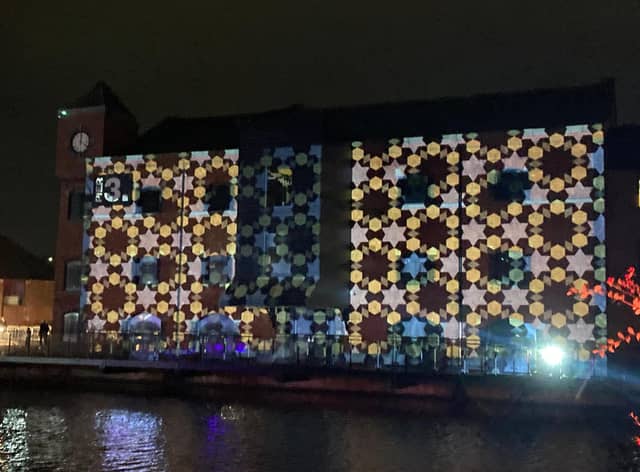 A mural was projected onto buildings at Wigan Pier