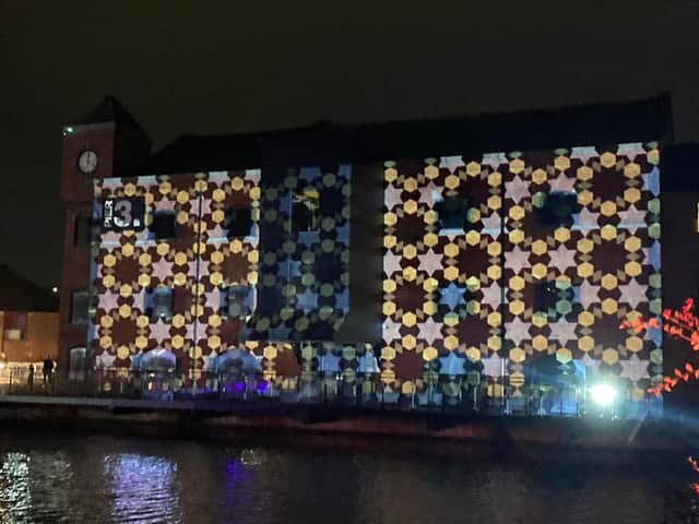 A mural was projected onto buildings at Wigan Pier