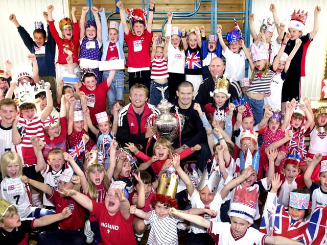 Cup of cheer for pupils at St. Bernadettes RC Primary School, Shevington, when Andy Farrell, Denis Betts and Mike Gregory brought the recently won Rugby League Challenge Cup to their Queens Golden Jubilee party on Thursday 30th of May 2002.