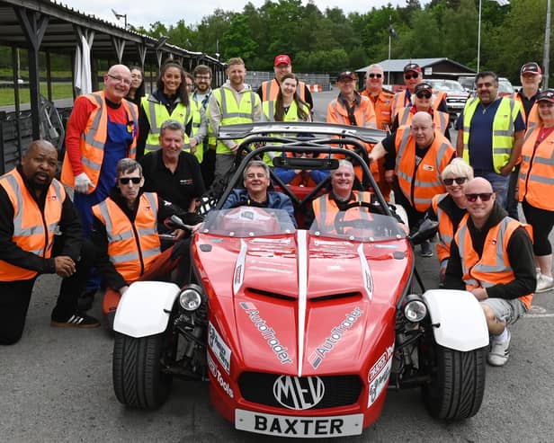 Some of the team at Speed of Sight, as the charity host a track day, inviting visually impaired and people with disabilities who otherwise wouldn't be able to get behind the wheel, drive at Three Sister Race Circuit, Ashton-in-Makerfield,