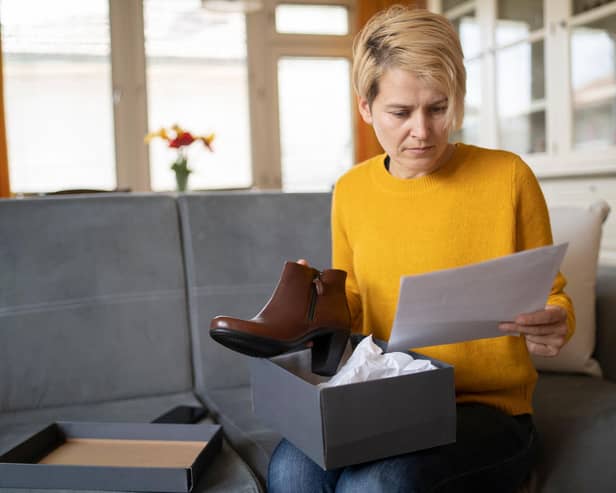Woman opening parcel