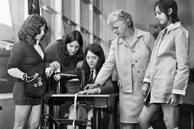 Modern young pupils making fashion gear with teacher Ada Wardle at Pemberton Secondary Girls School in September 1971.